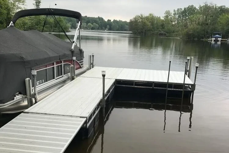 Starr aluminum floating dock with pontoon boat on Michigan lake